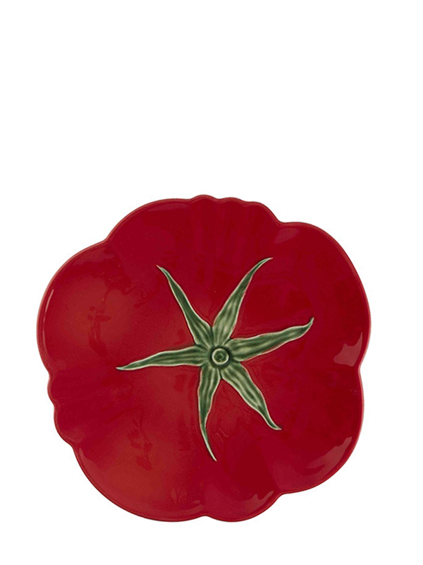 A red earthenware dinner plate with a green stem and leaf design in the center, resembling the appearance of a tomato.