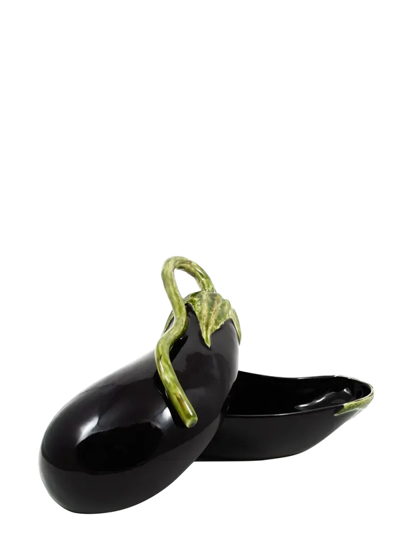 A decorative ceramic jar designed to resemble an eggplant, with a glossy purple finish and green leaf-like details at the top.