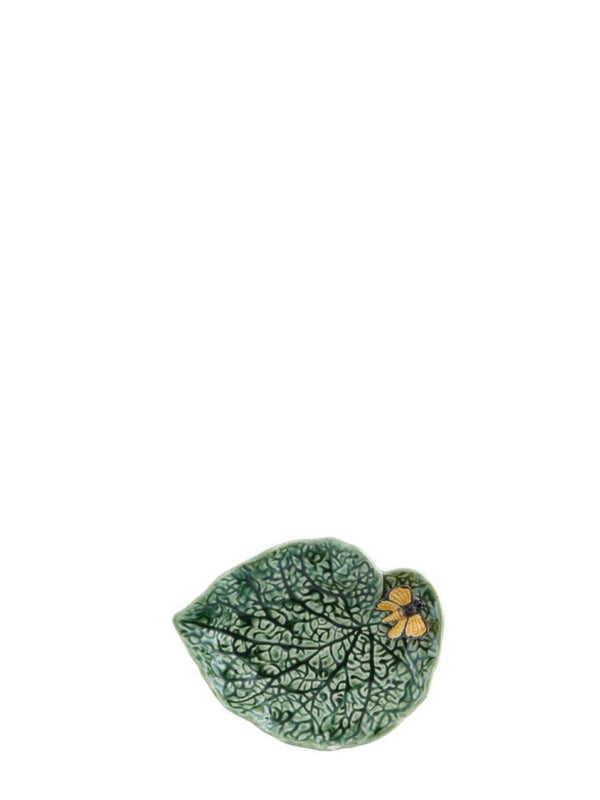 Ceramic leaf-shaped dish with floral design on a white background