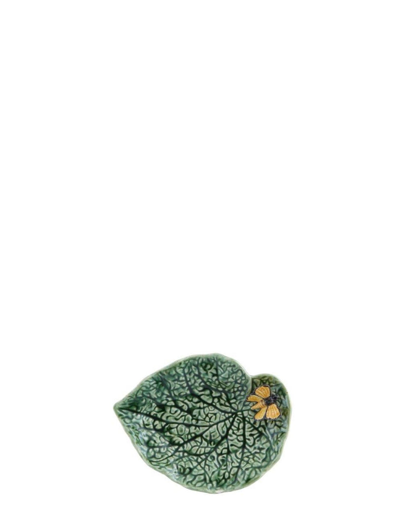 Ceramic leaf-shaped dish with floral design on a white background