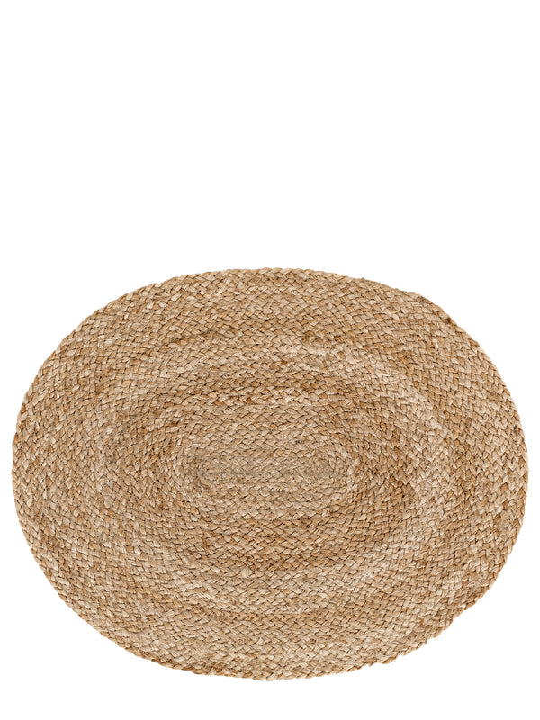An oval-shaped, hand-braided placemat made from natural jute fibers.