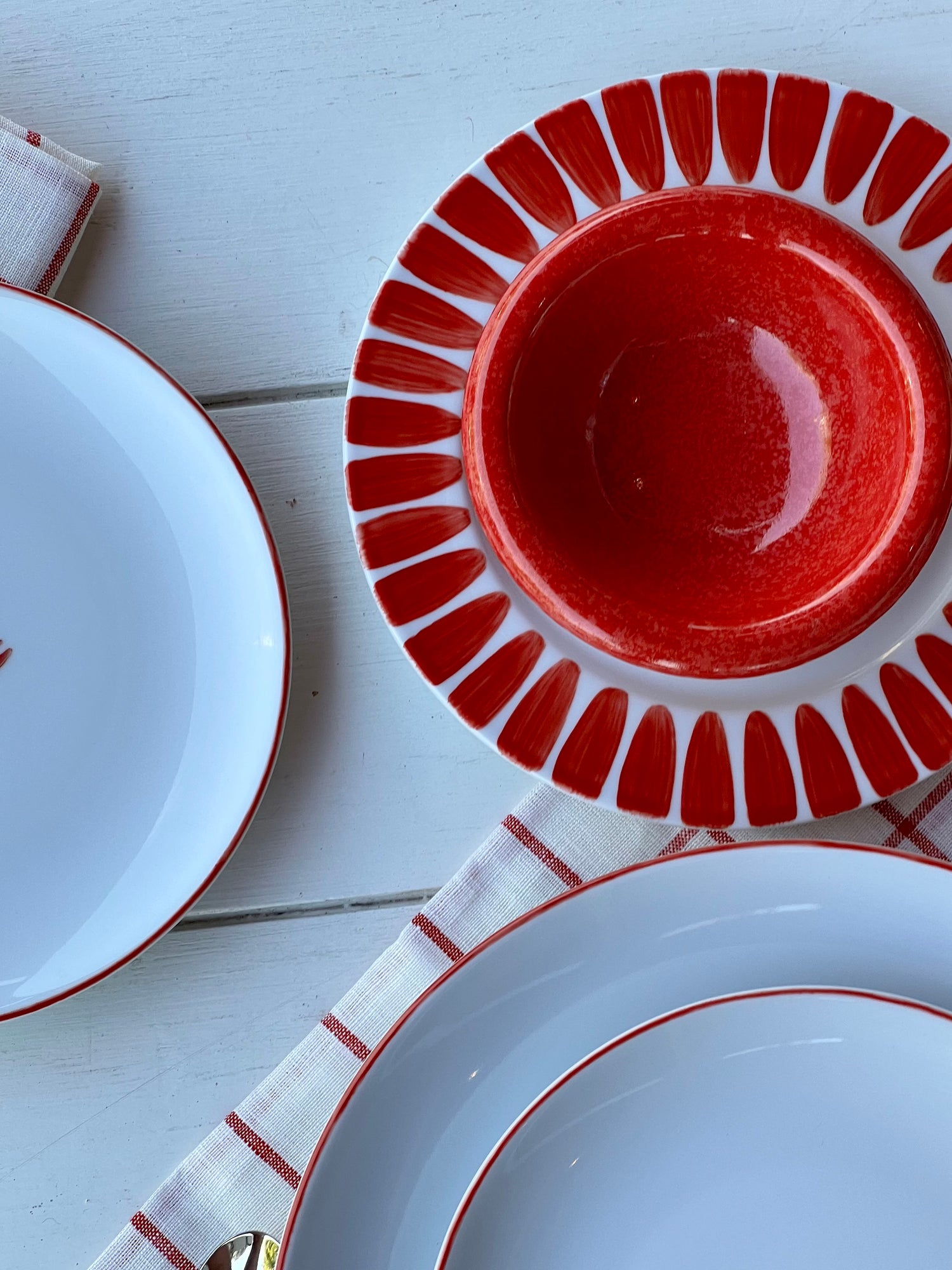 Red dessert plate with handpainted border