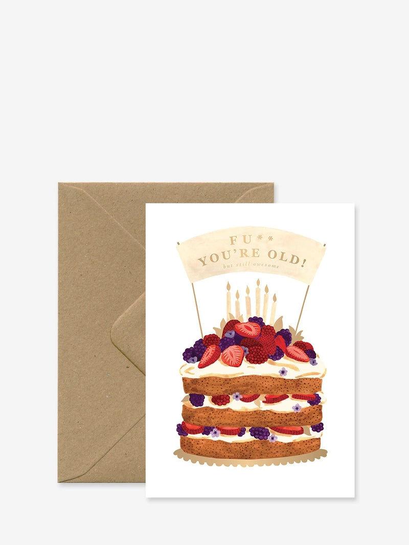 A birthday card with an illustration of a cake and candles, with a humorous message, accompanied by a brown envelope.