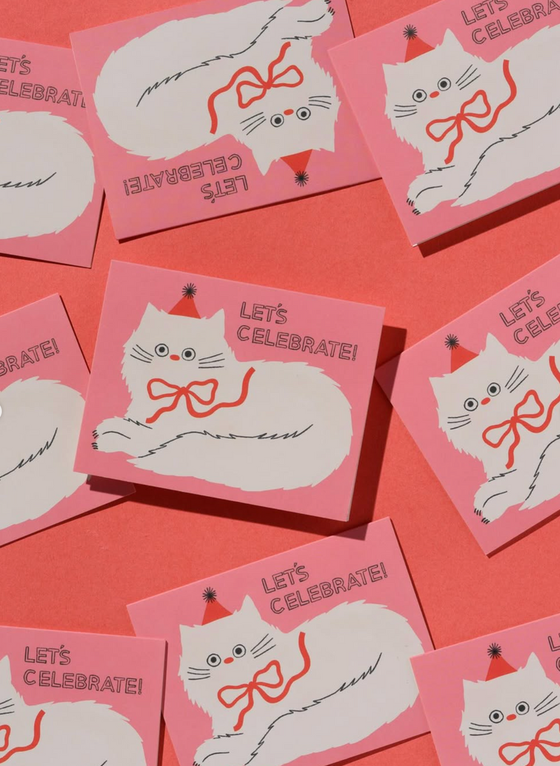 Pink cards with cat illustrations and 'Let's Celebrate!' text on a pink background