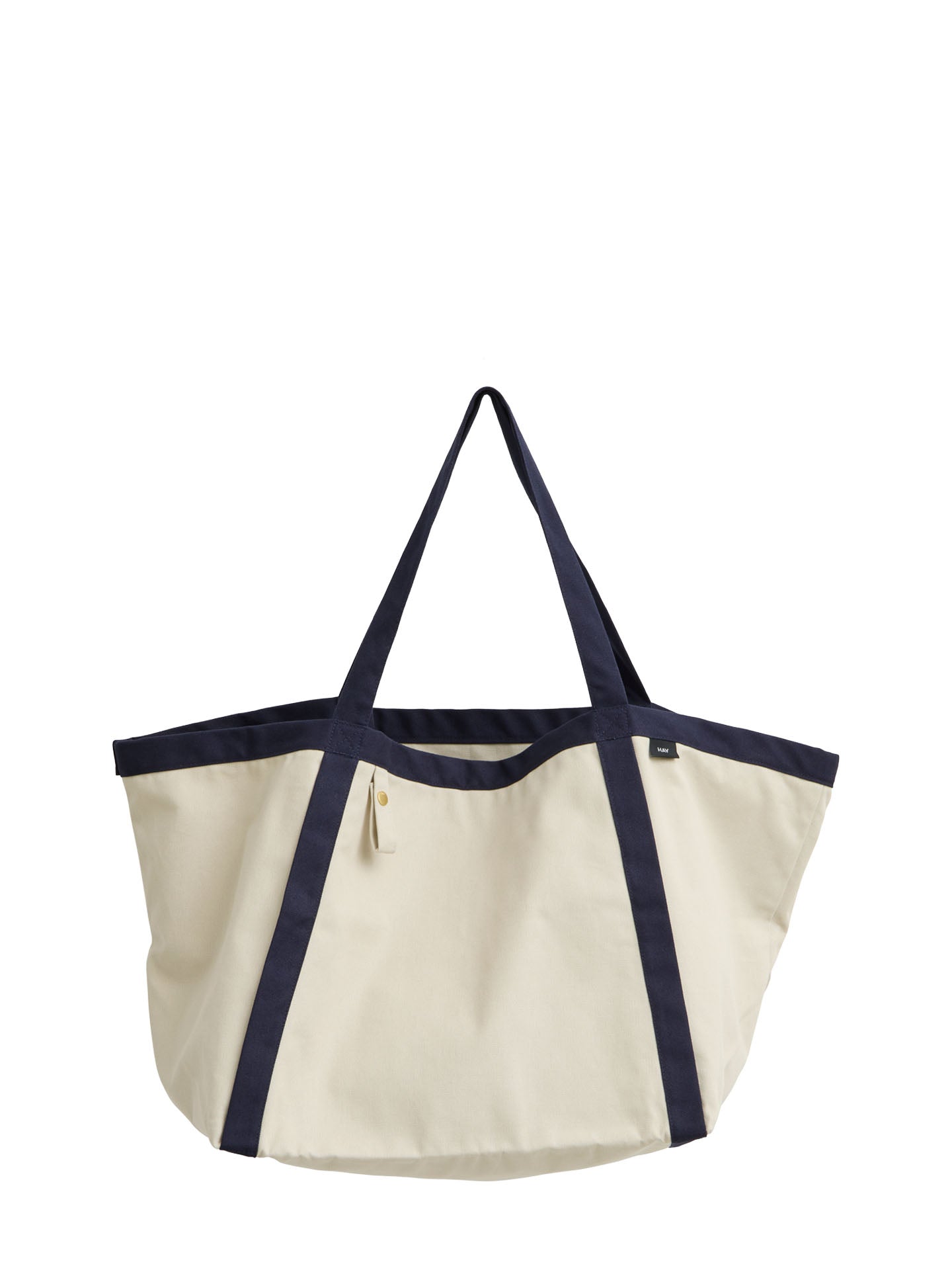 An off-white canvas tote bag with dark navy blue trim and handles, shown against a plain white background.