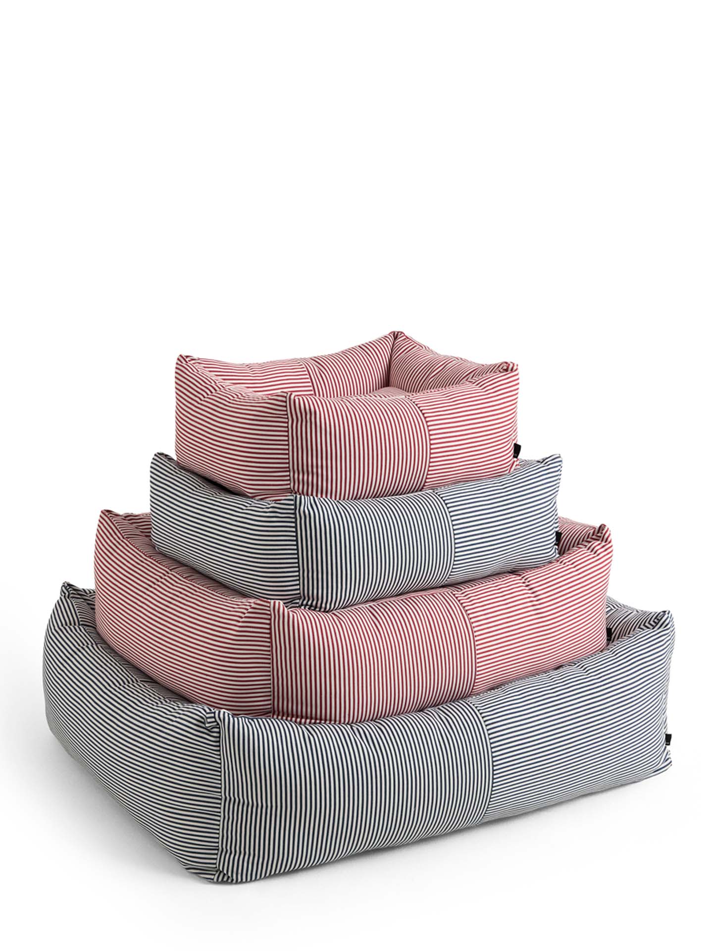 Three nested square pet beds with striped fabric, stacked in a pyramid. The largest bed at the bottom is gray and white striped, the middle bed is pink and white striped, and the smallest top bed is gray and white striped.