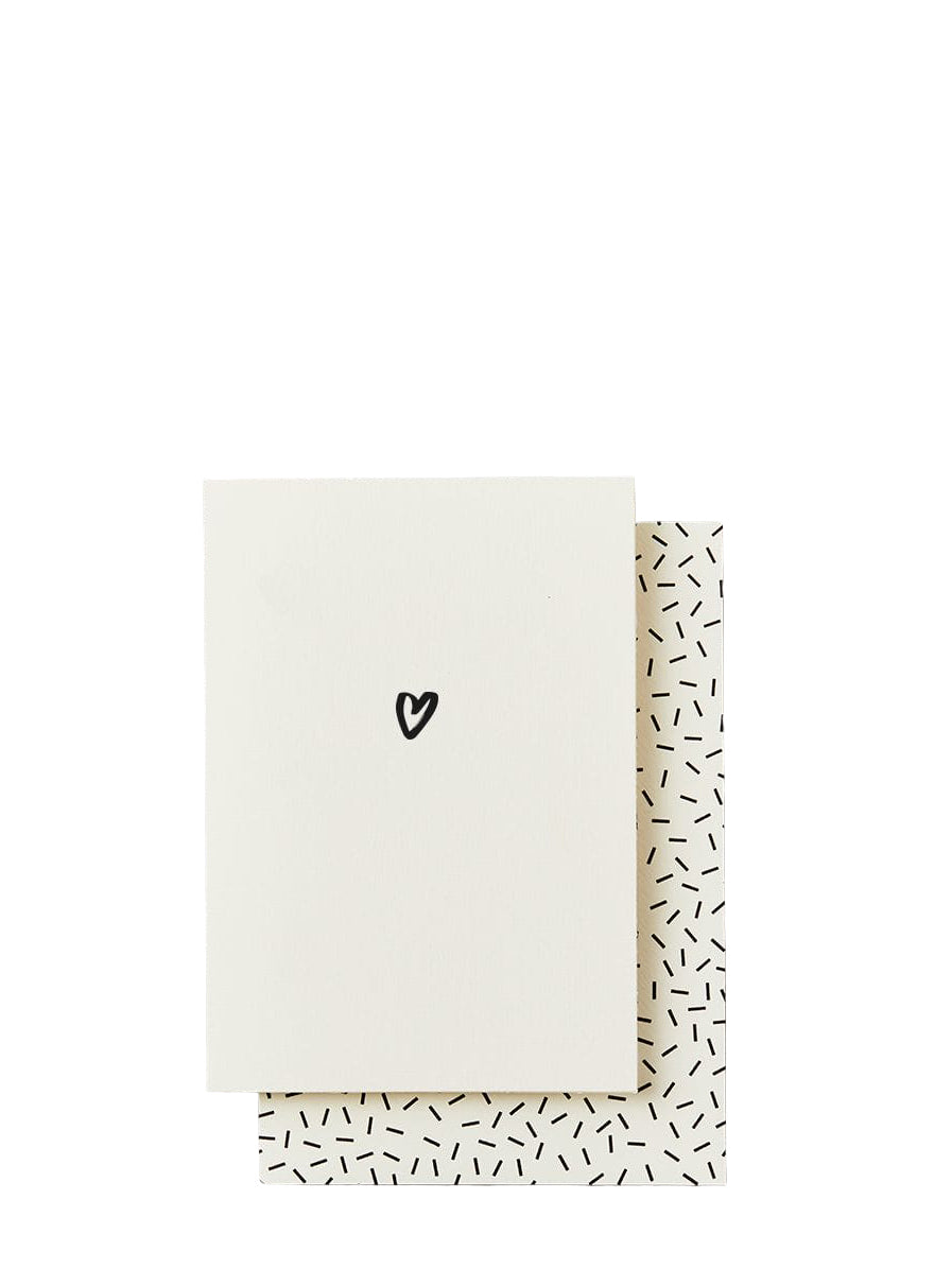 Greeting card with a heart design on the cover and geometric pattern on the side