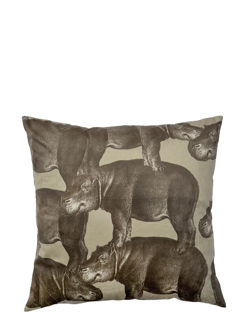 Decorative pillow with rhino illustrations on a beige background