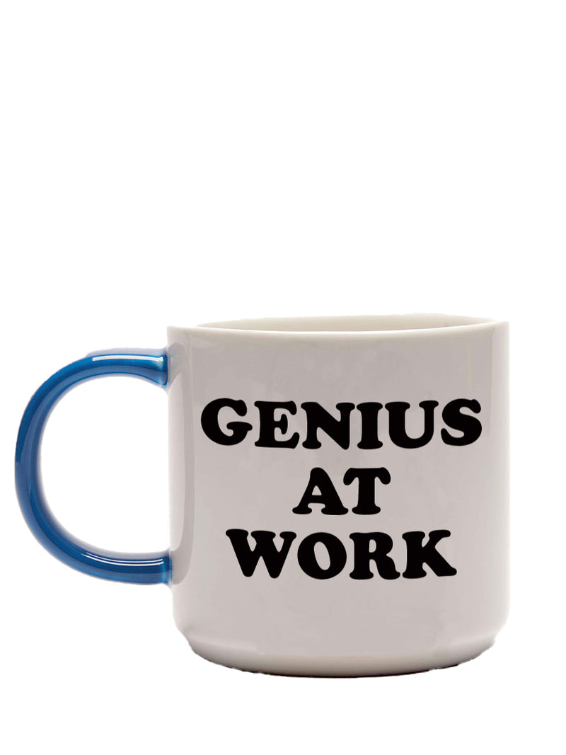 Genius at work text at a large white porcelain coffee or tea mug with a good-sized blue handle.