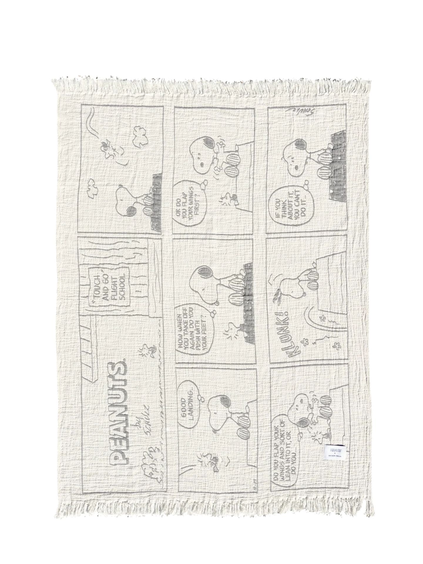 Blanket with black and white comic strip pattern on a white background
