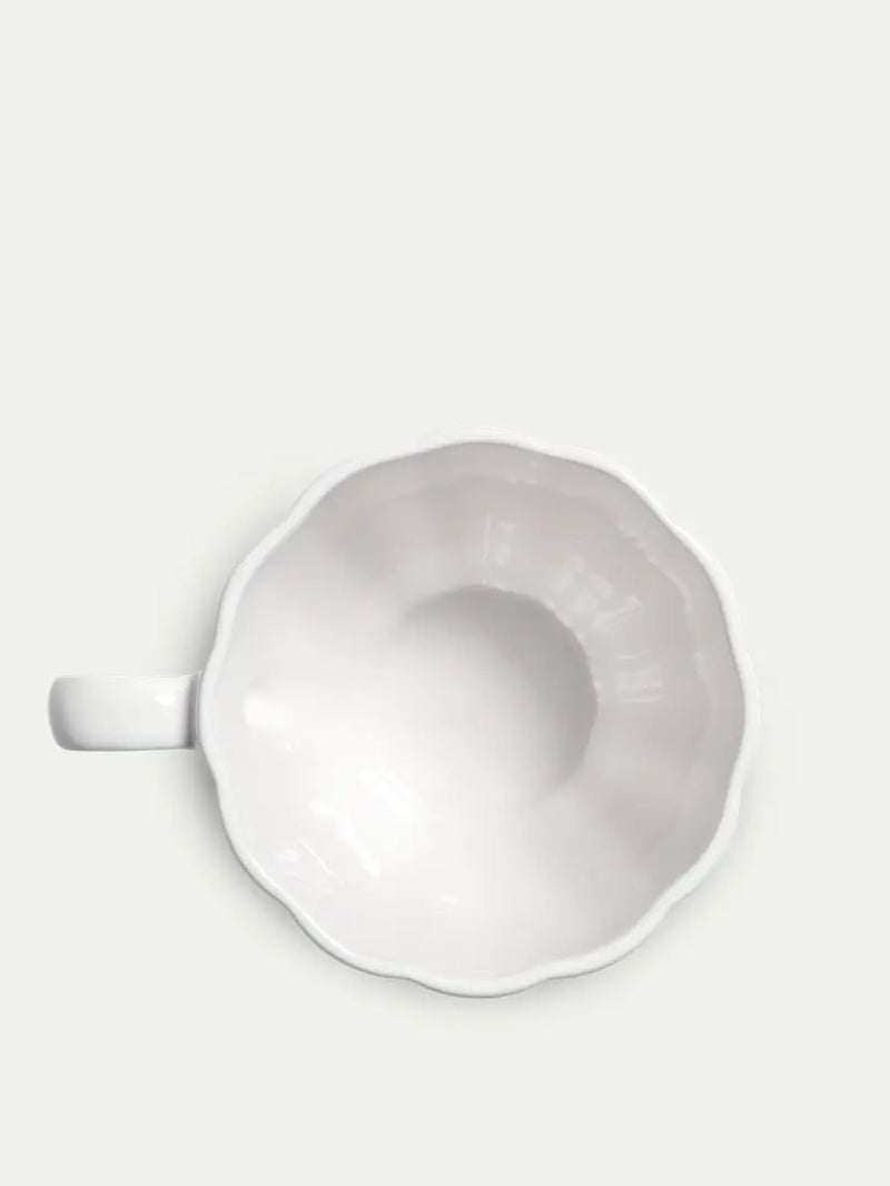 White ceramic bowl on a light gray background