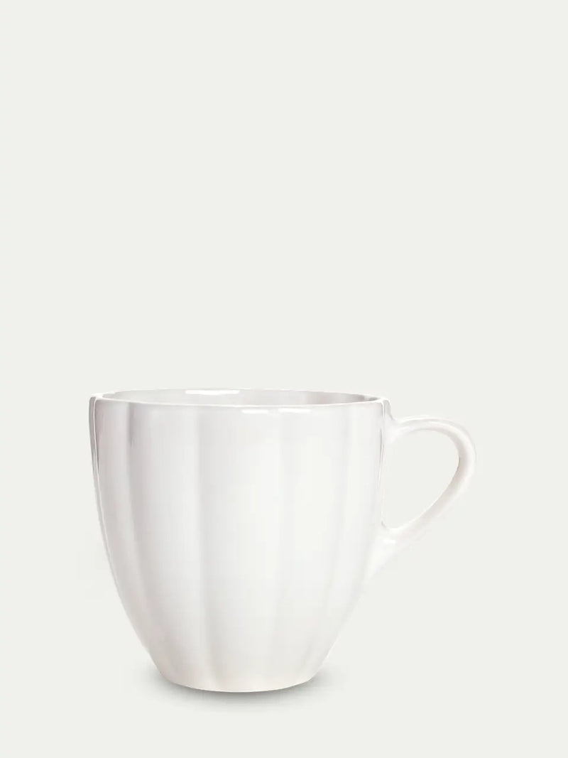 White ceramic mug on a light gray background