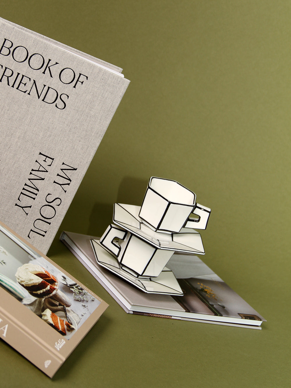 Stack of books with espresso cups