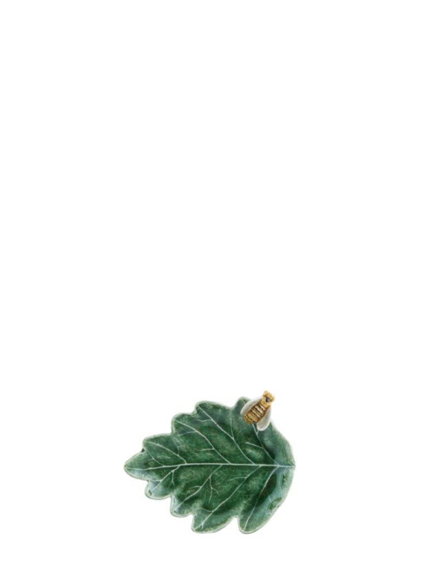 Green leaf-shaped pendant on a white background