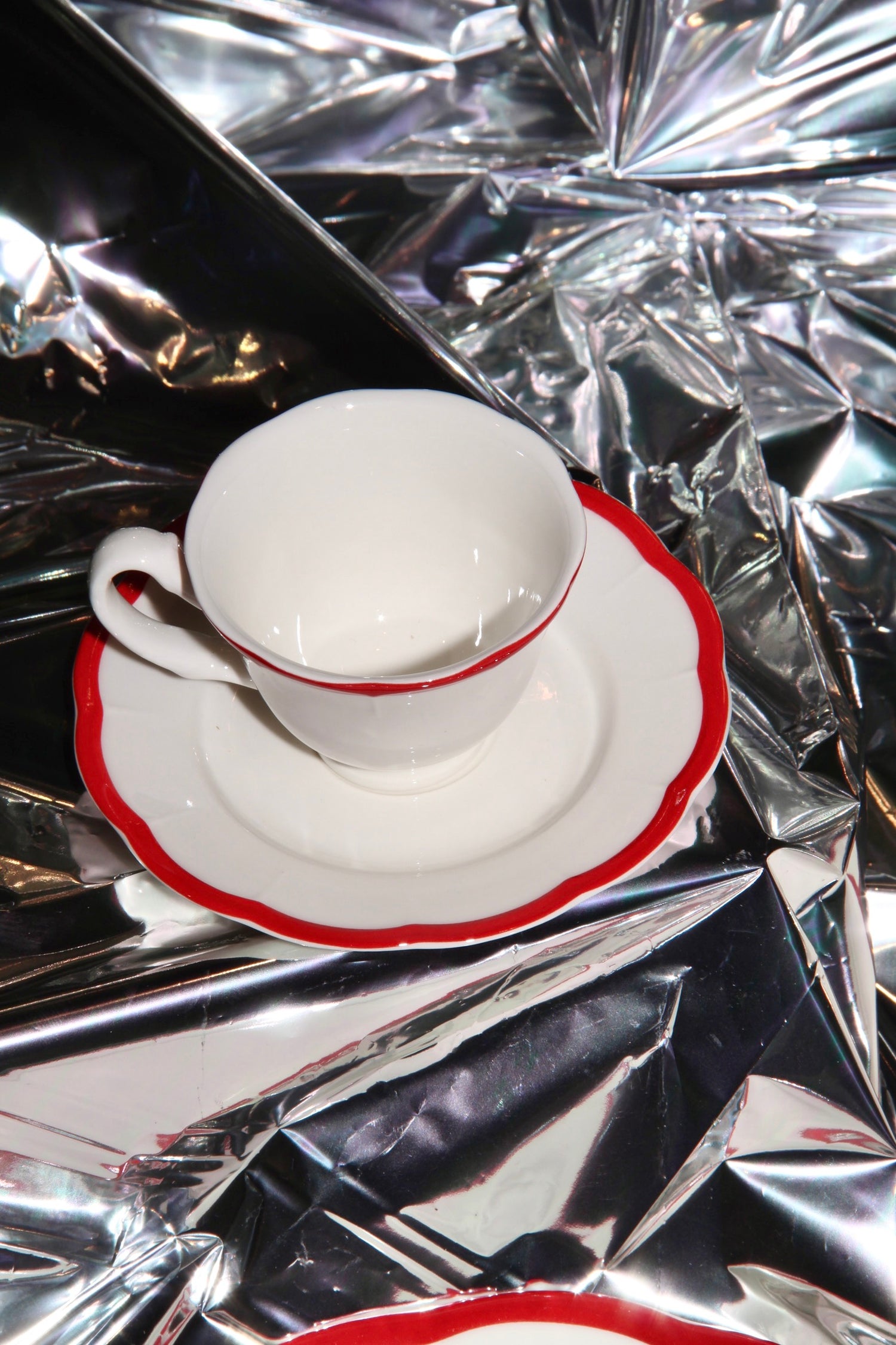 Red scalloped edge espresso cup and saucer set