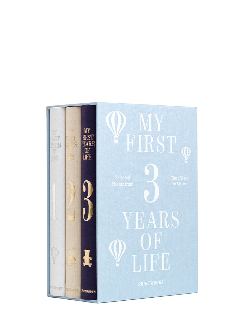 Book titled 'My First 3 Years of Life' with a white cover and gold text on a white background