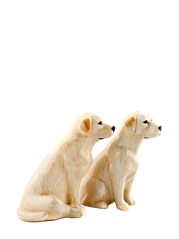 A pair of hand painted stoneware salt and pepper shakers shaped like yellow labradors.