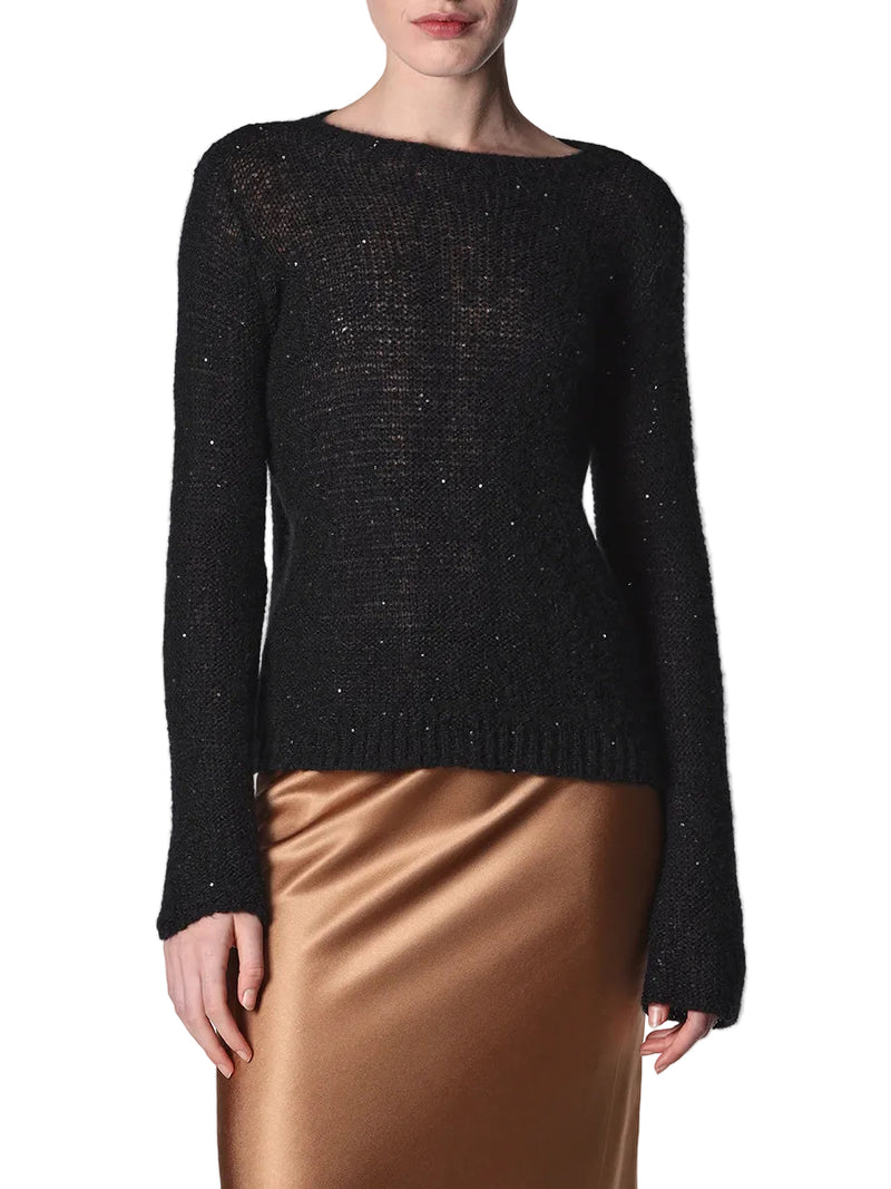 Black textured sweater worn by a person on a white background