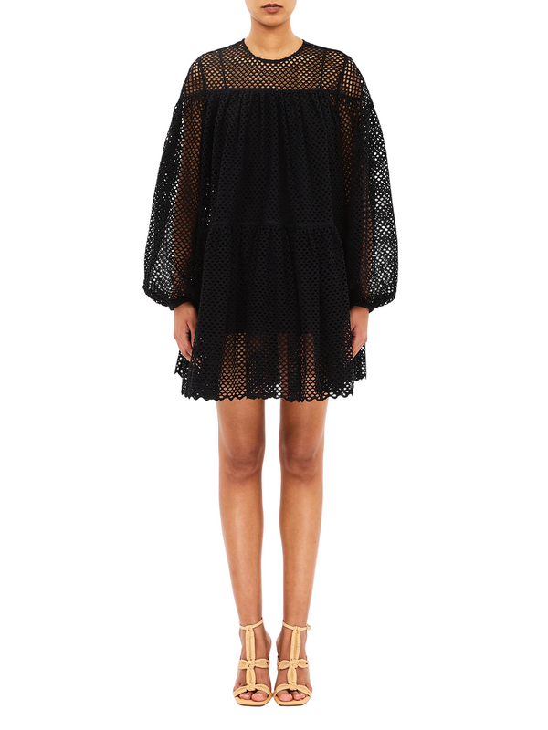 Woman wearing black mini dress by Ulla Johnson
