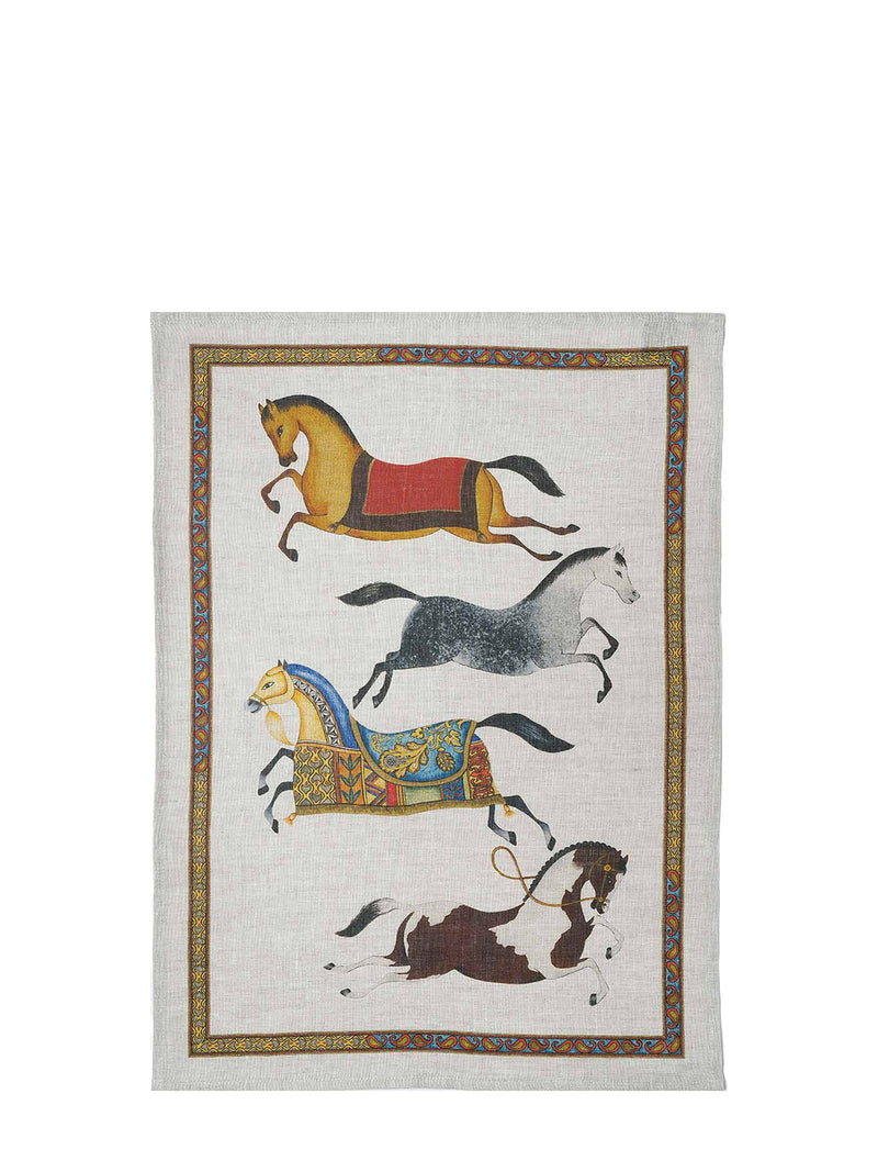 Decorative printed tea towel with four stylized horses in different levels of reneissance gear leaping on left and right inside a frame, shown against a white background