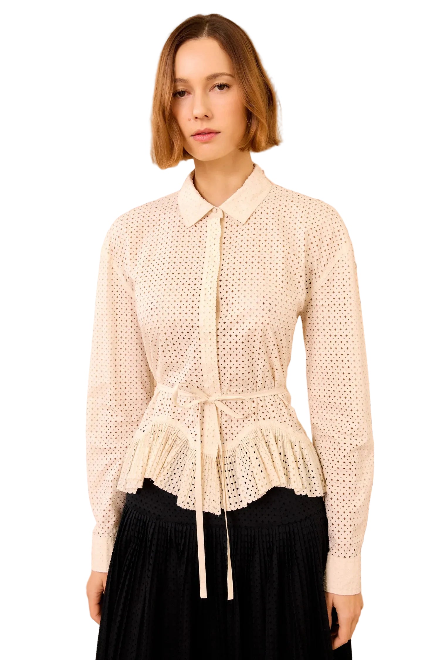 Woman wearing a white lace blouse by Ulla Johnson