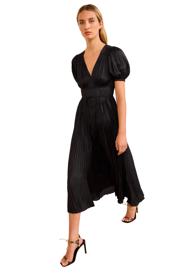 Woman wearing a black dress aby Ulla Johnson