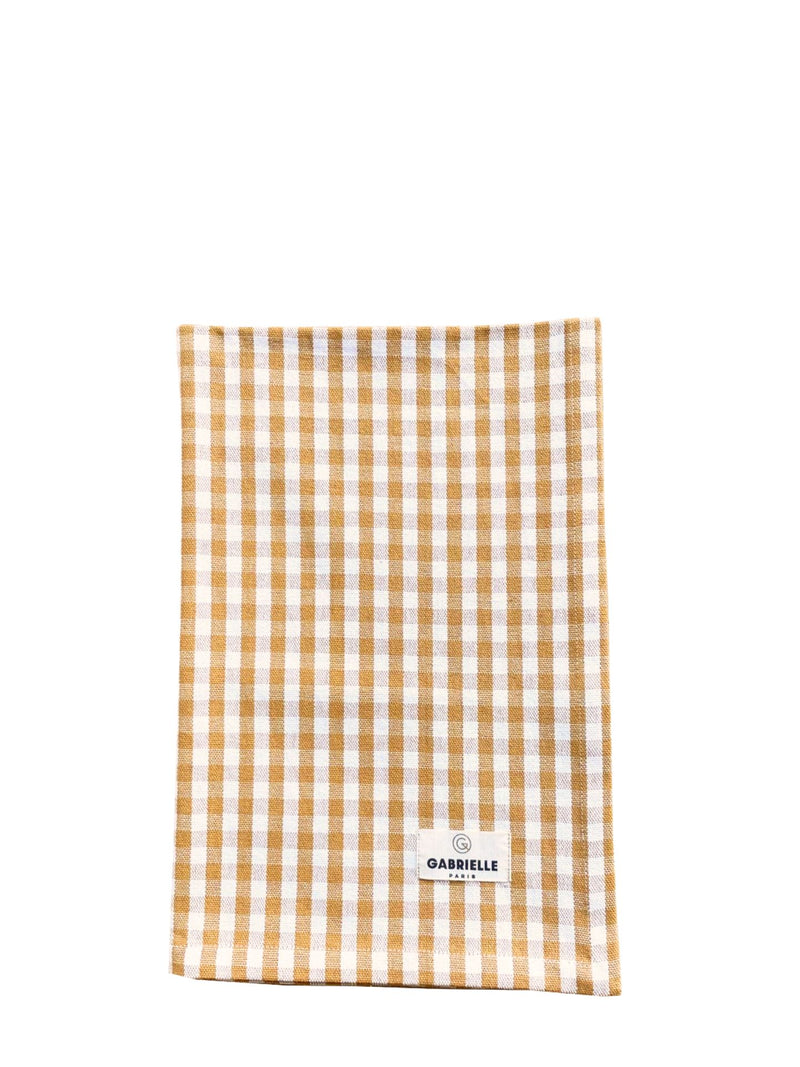 Checkered towel with a brand label on a white background