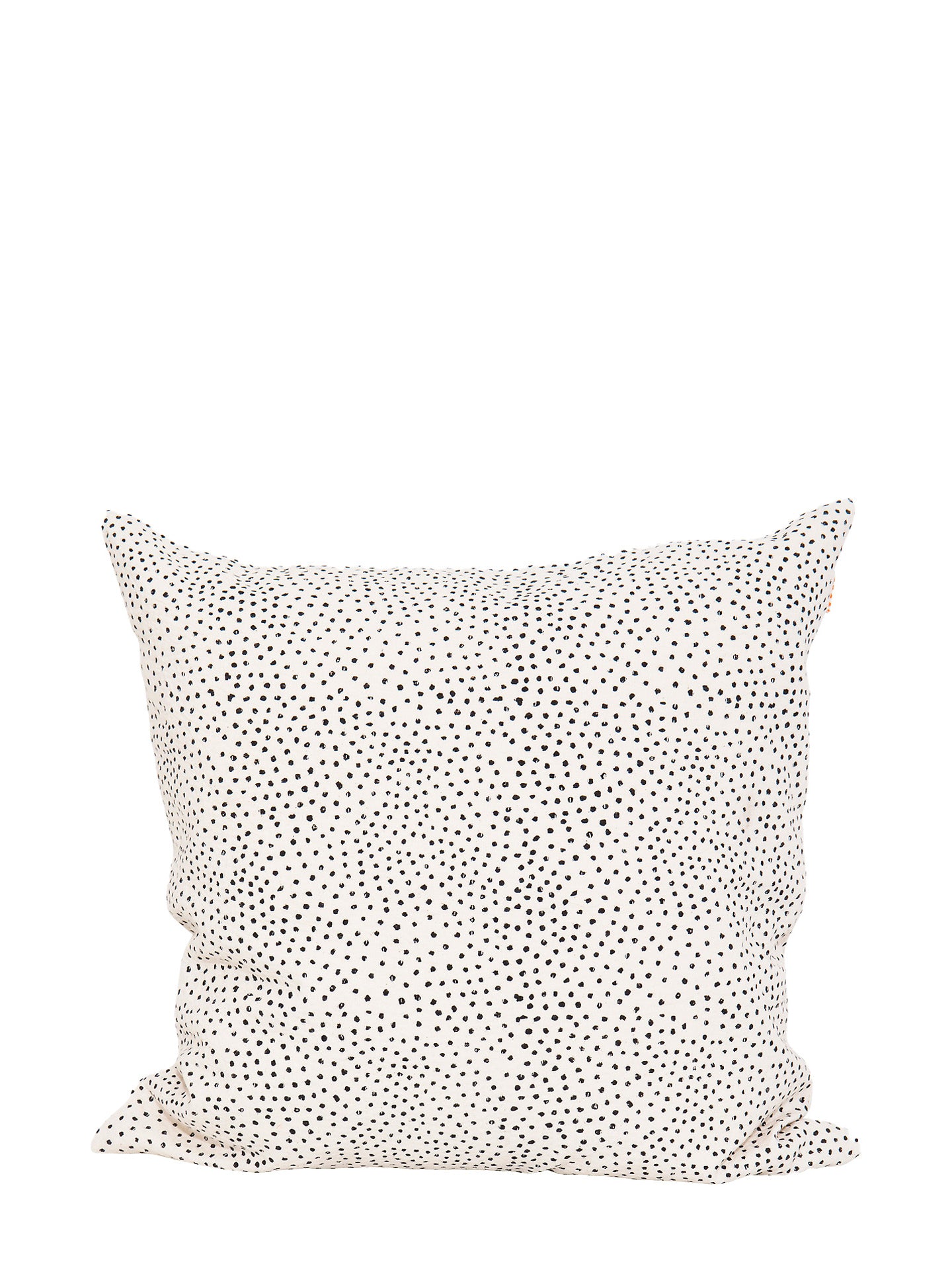 A square cushion made from off-white cotton with black hand-printed flecks or irregular little dots suitable for home decoration such as couches, settees, sofas and armchairs, standing against a white background.