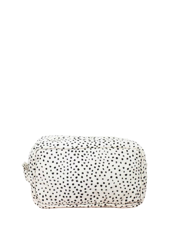 White pouch with black polka dots on a white background