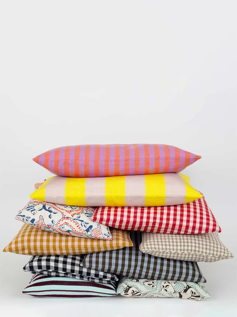 Stack of colorful pillows on a white background
