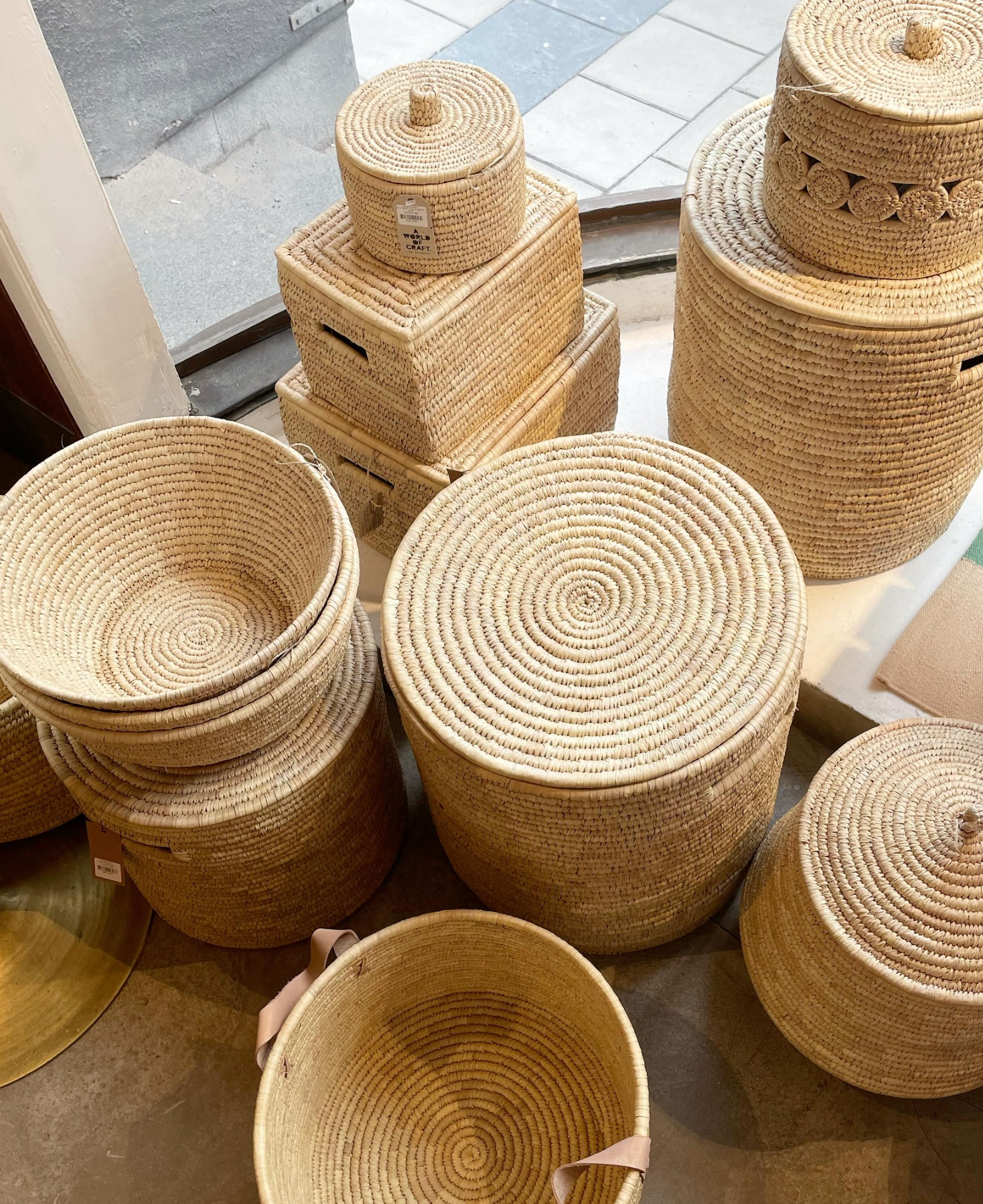 Collection of woven palm baskets and boxes by A World of Craft