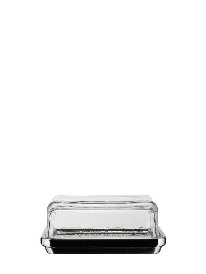 A clear glass butter dish made fro stainless steel base with silver metal trim, and a glass top shown from a front-facing perspective on a solid white background.