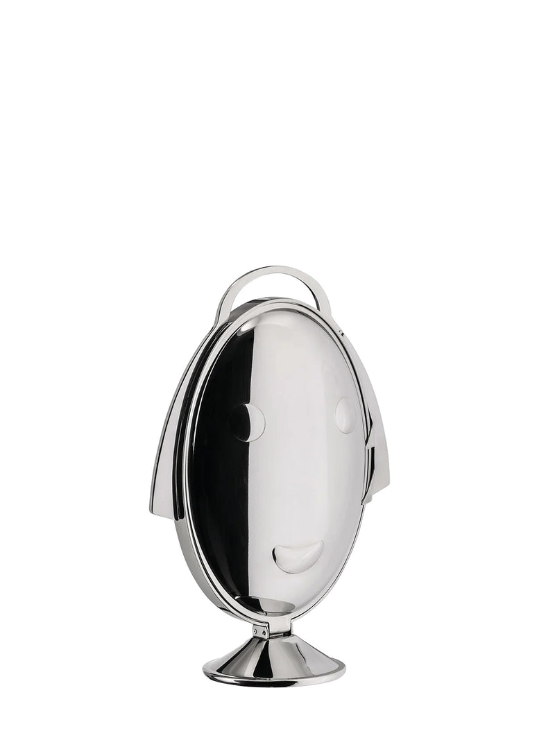 A closed cake stand shows a polished silver oval face of Anna Gong with carrying loop on top of her head, shown on a plain white background
