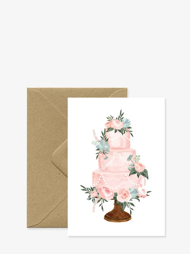 Greeting card with a pink floral cake design on a white background