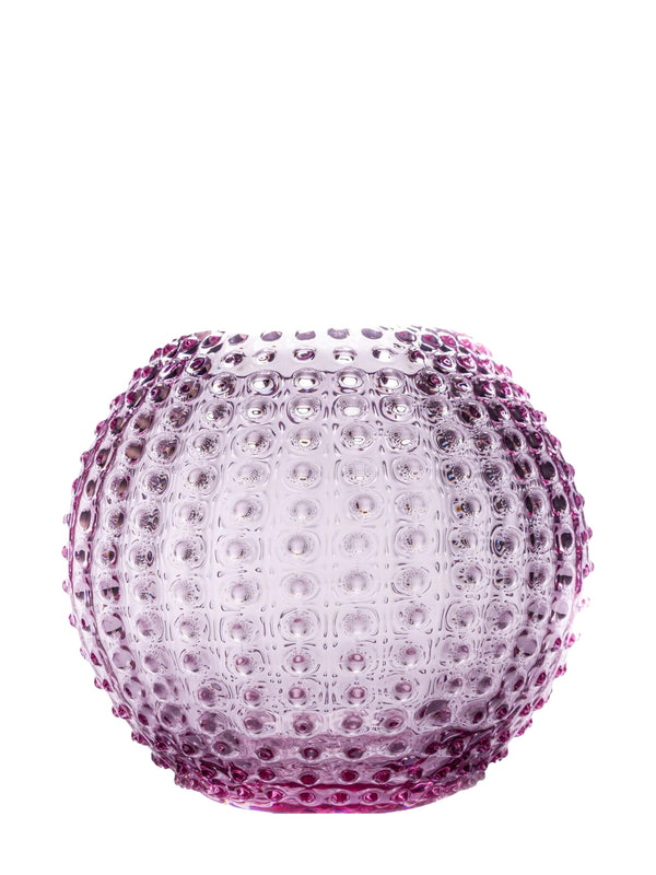 Large round glass vase in amethyst purple glass with a textured surface on a white background