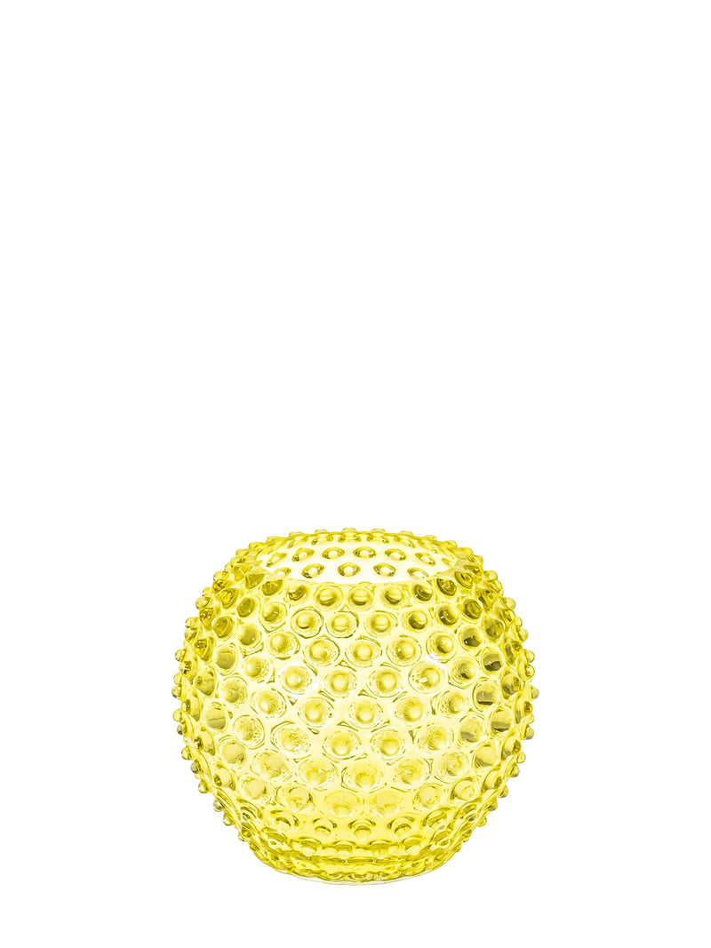 Yellow textured glass vase on a white background