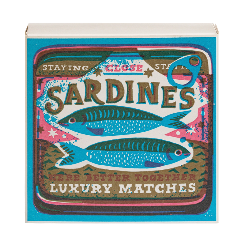 Box of matches with sardine design and text on a white background