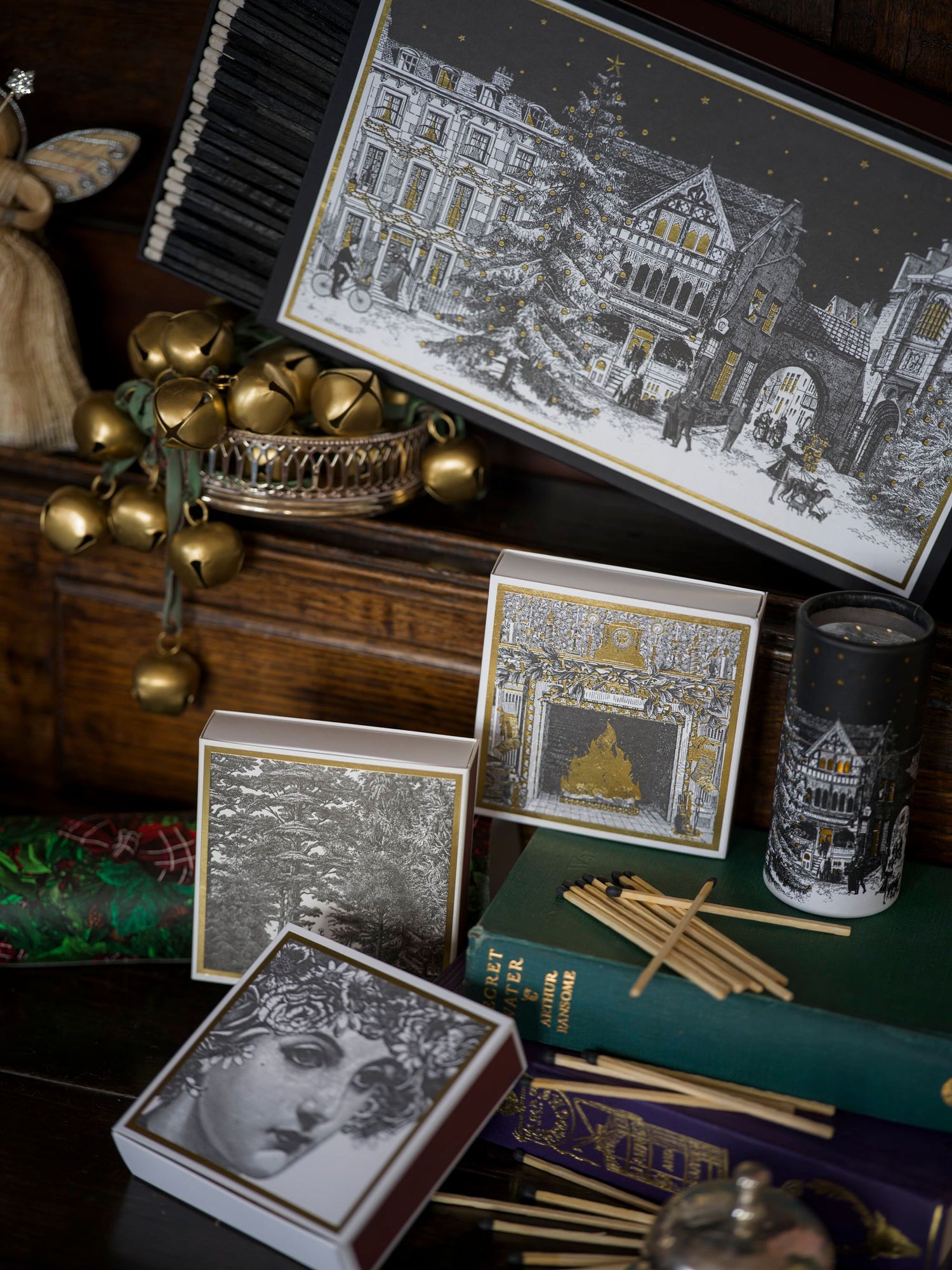 Decorative items including cards and a map on a wooden surface with a dark background.