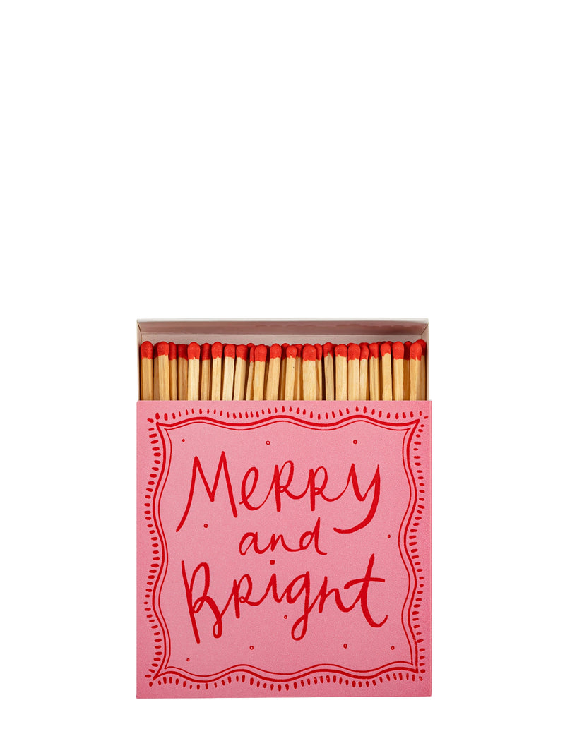 Matchbox with 'Merry and Bright' text on a white background