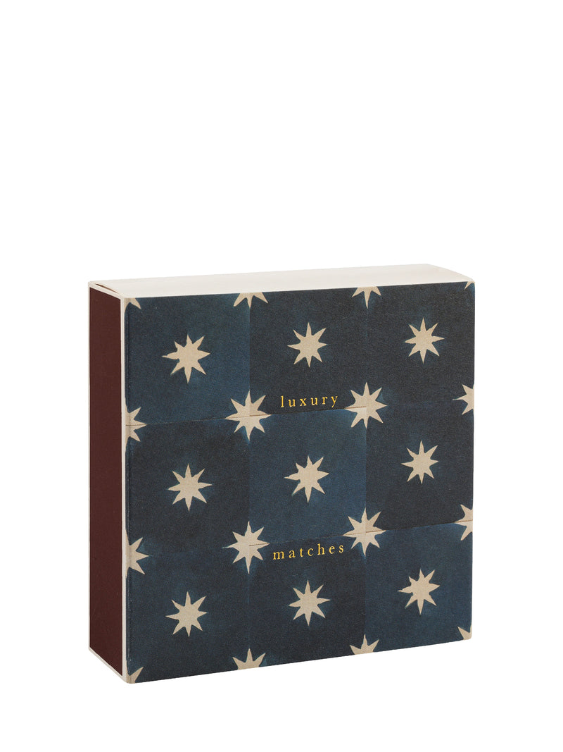 Box of matches with star pattern and 'luxury matches' text on a white background