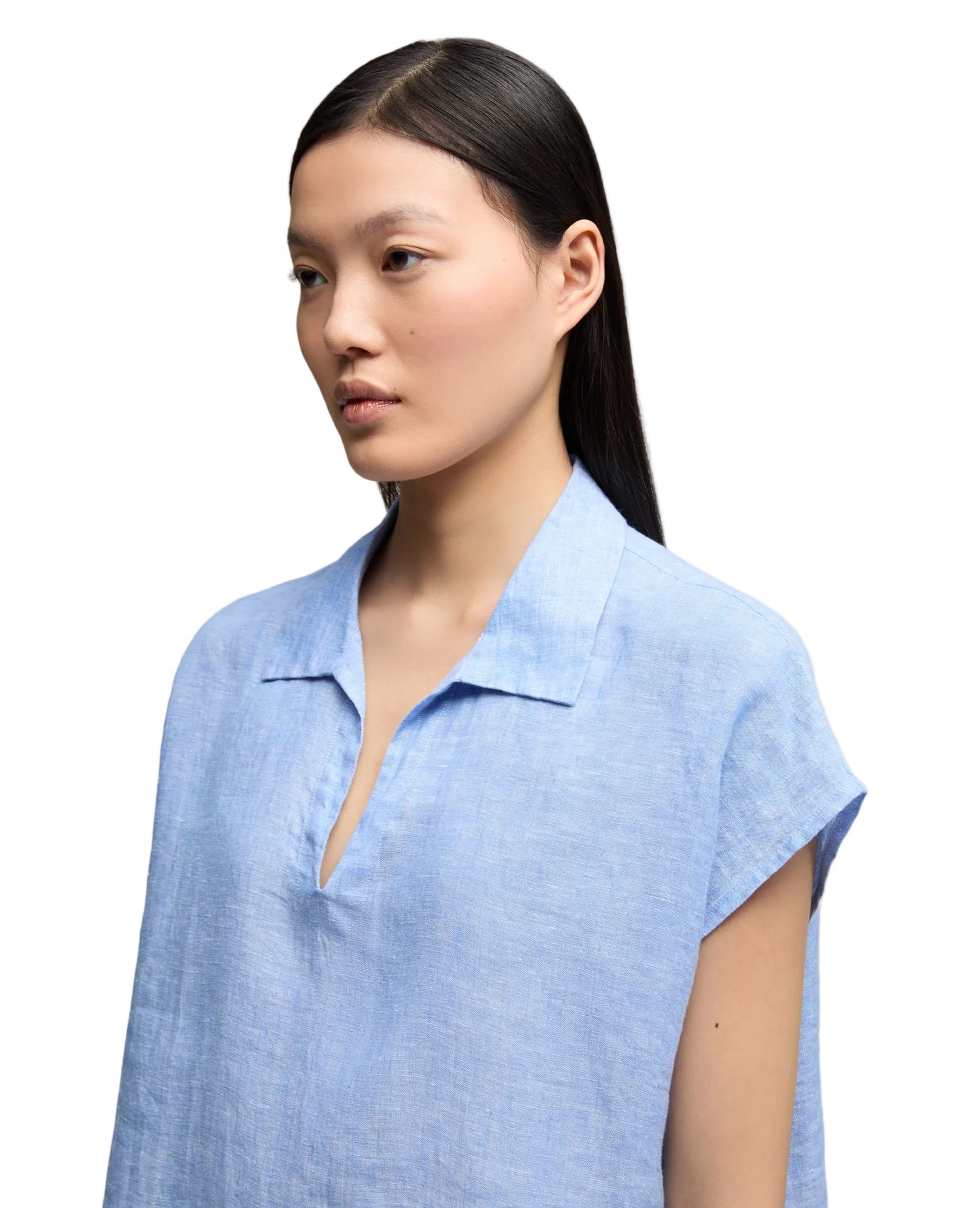 Woman wearing a light blue linen shirt by Aspesi