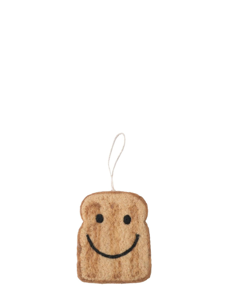 Smiley face toast ornament on a white background