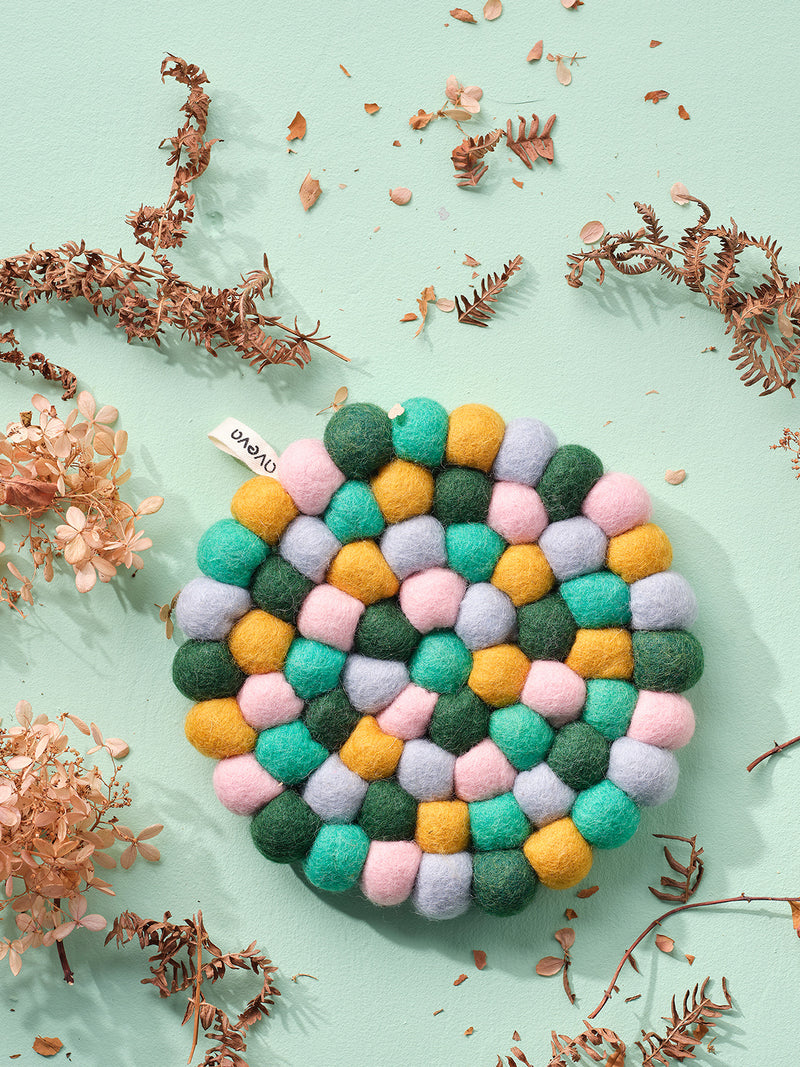 Round felted wool trivet, emerald