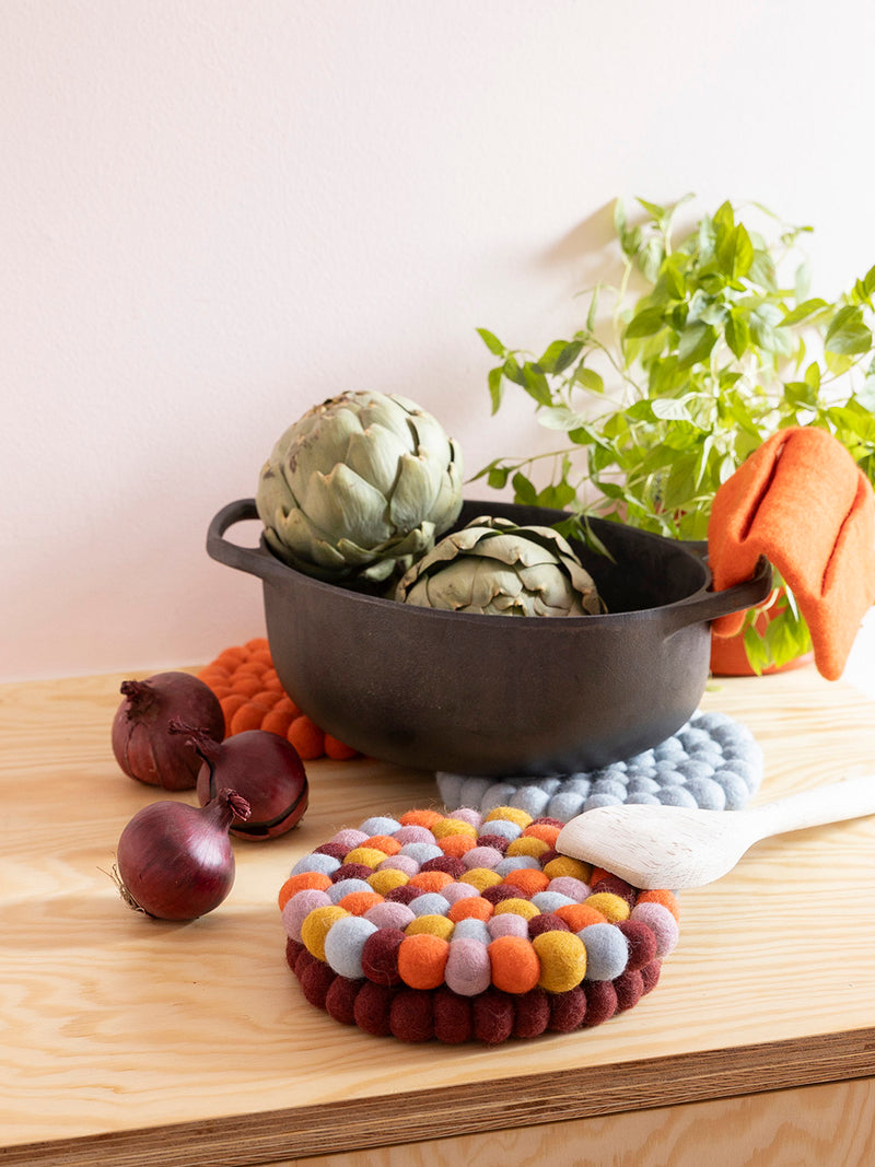 Round felted wool trivet, festive multi