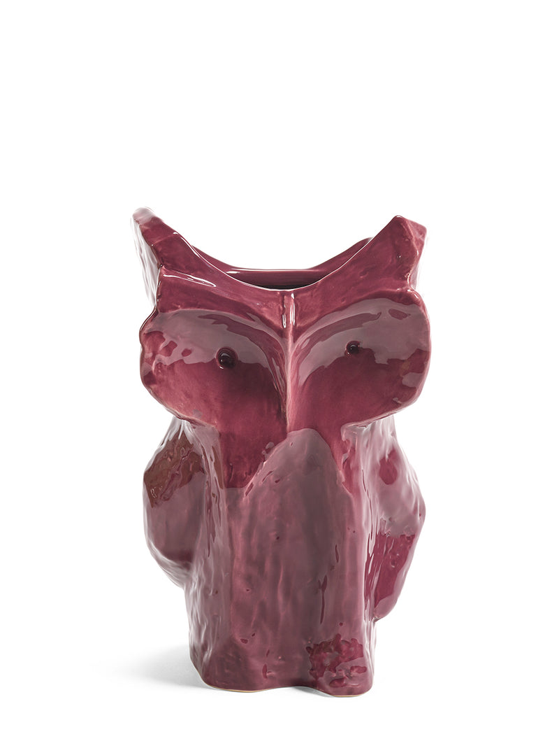 Purple ceramic owl-shaped vase on a white background