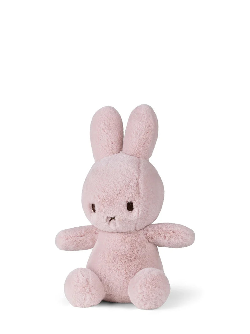 Pink plush bunny toy on a white background