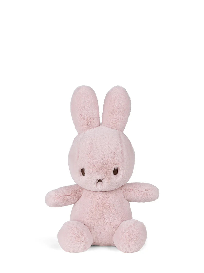 Pink plush bunny toy on a white background