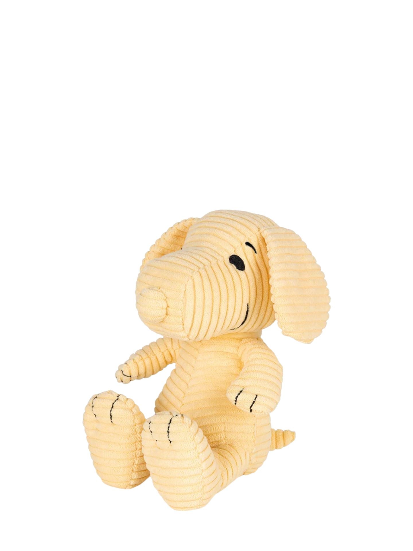 Yellow plush dog toy on a white background