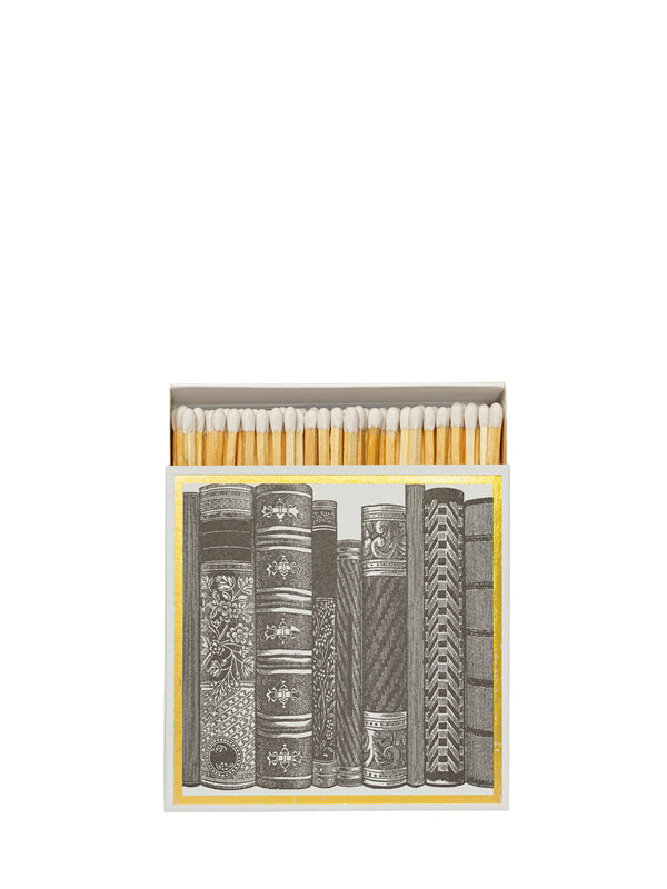 Matches in a box with book design on a white background