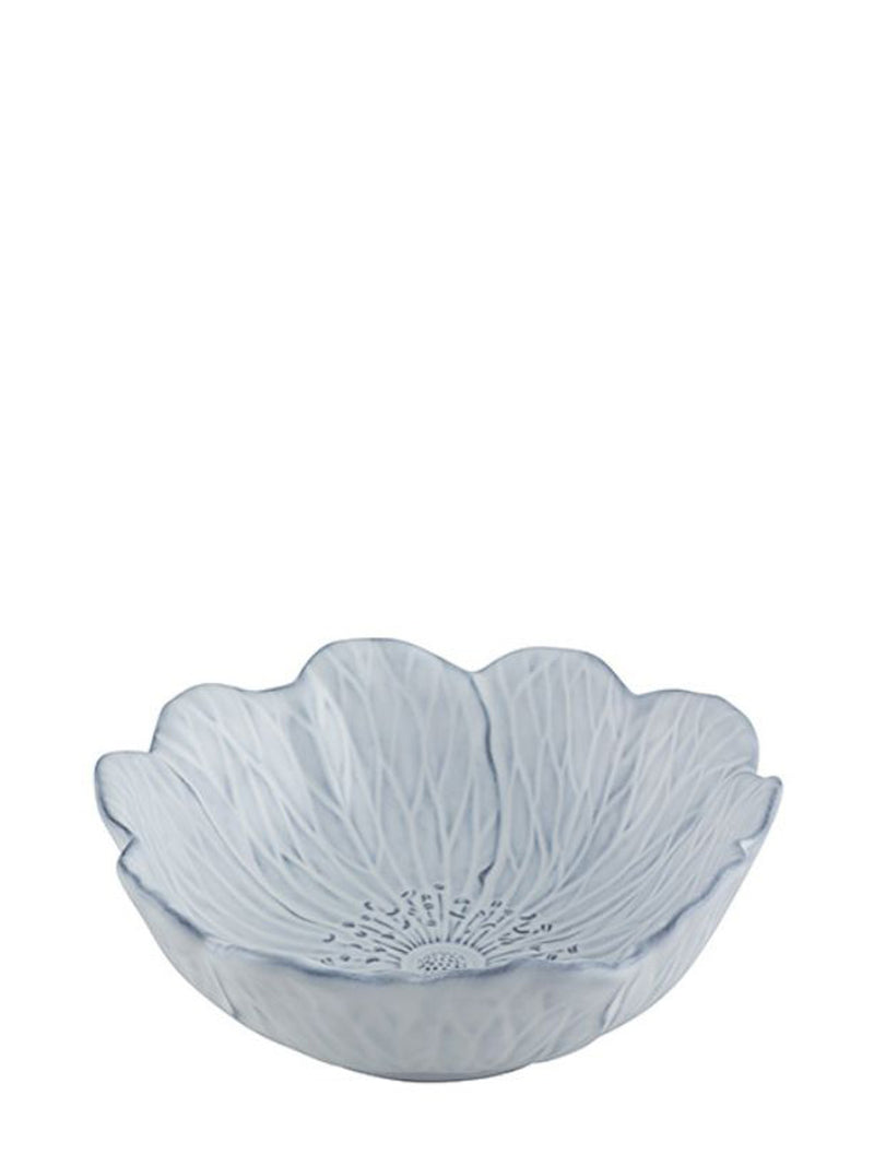 Decorative bowl with flower shaped design made of white glazed earthenware on a white background